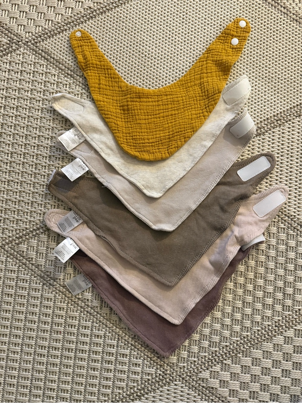 A bundle of 6 100% cotton and muslin baby bibs